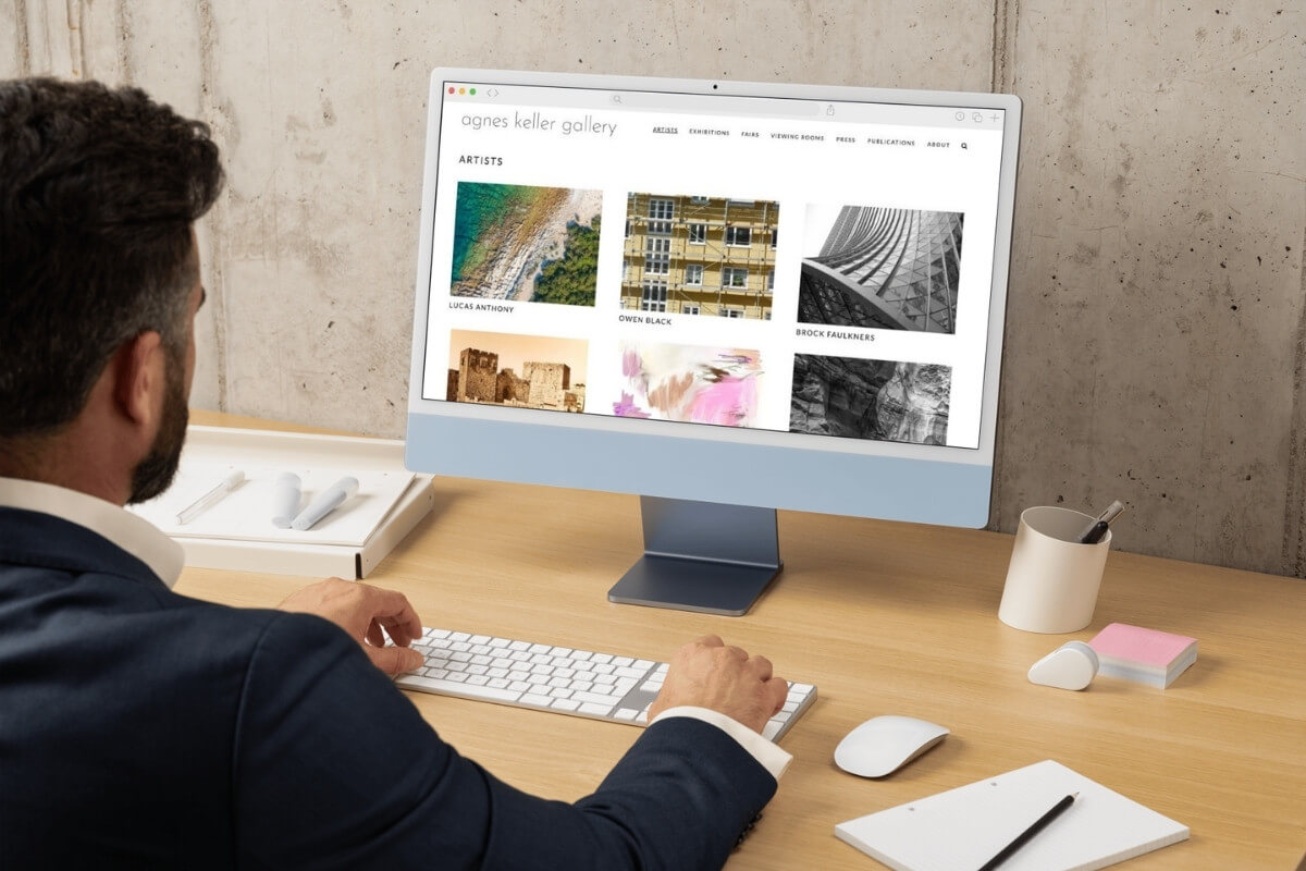 man-looking-at-artist-page-designed-with-showroom