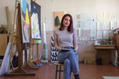 young artist in her painting studio