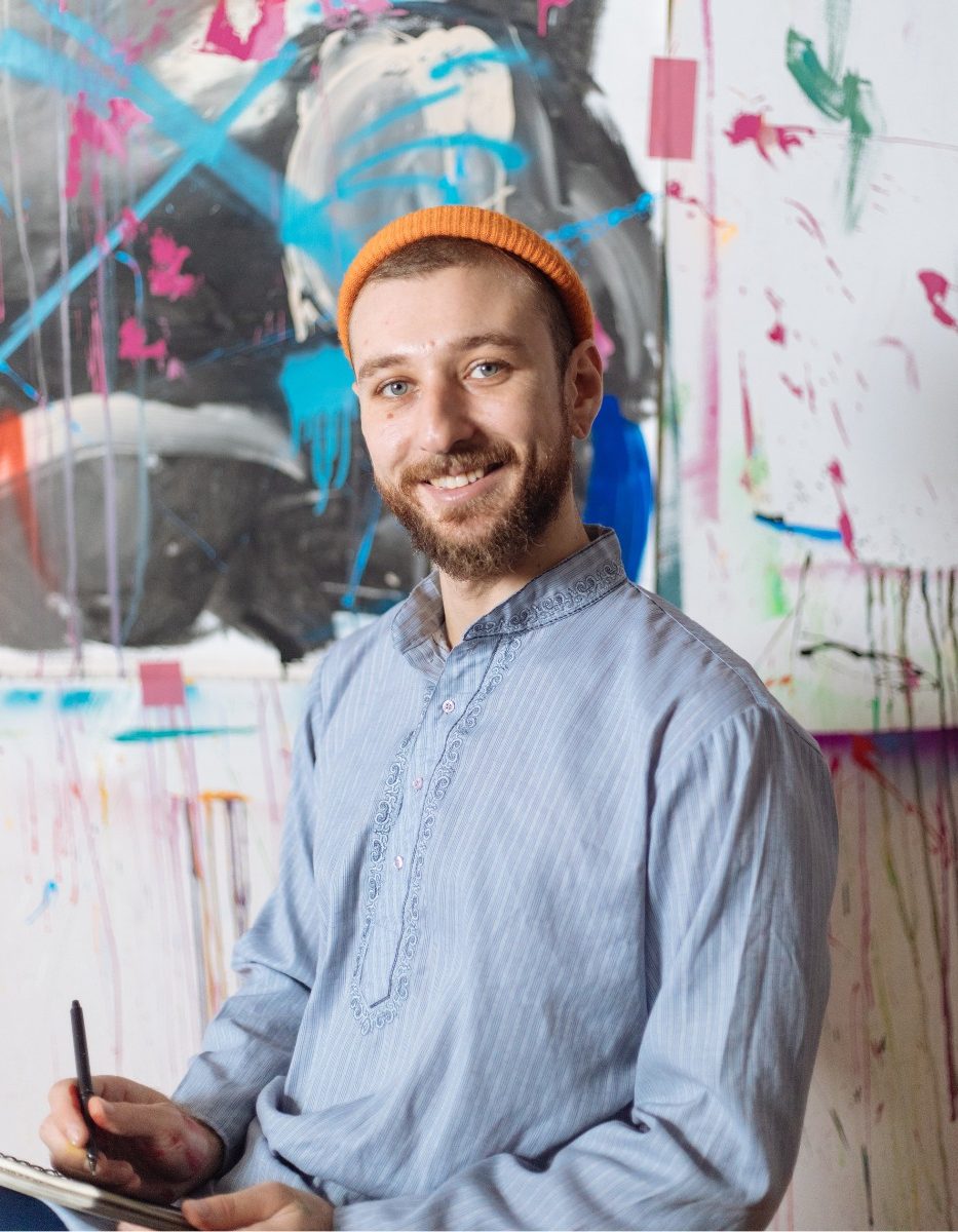 artist in his colorful studio