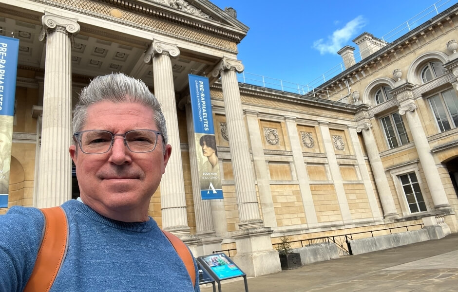 Chris Alexander standing in front of a museum