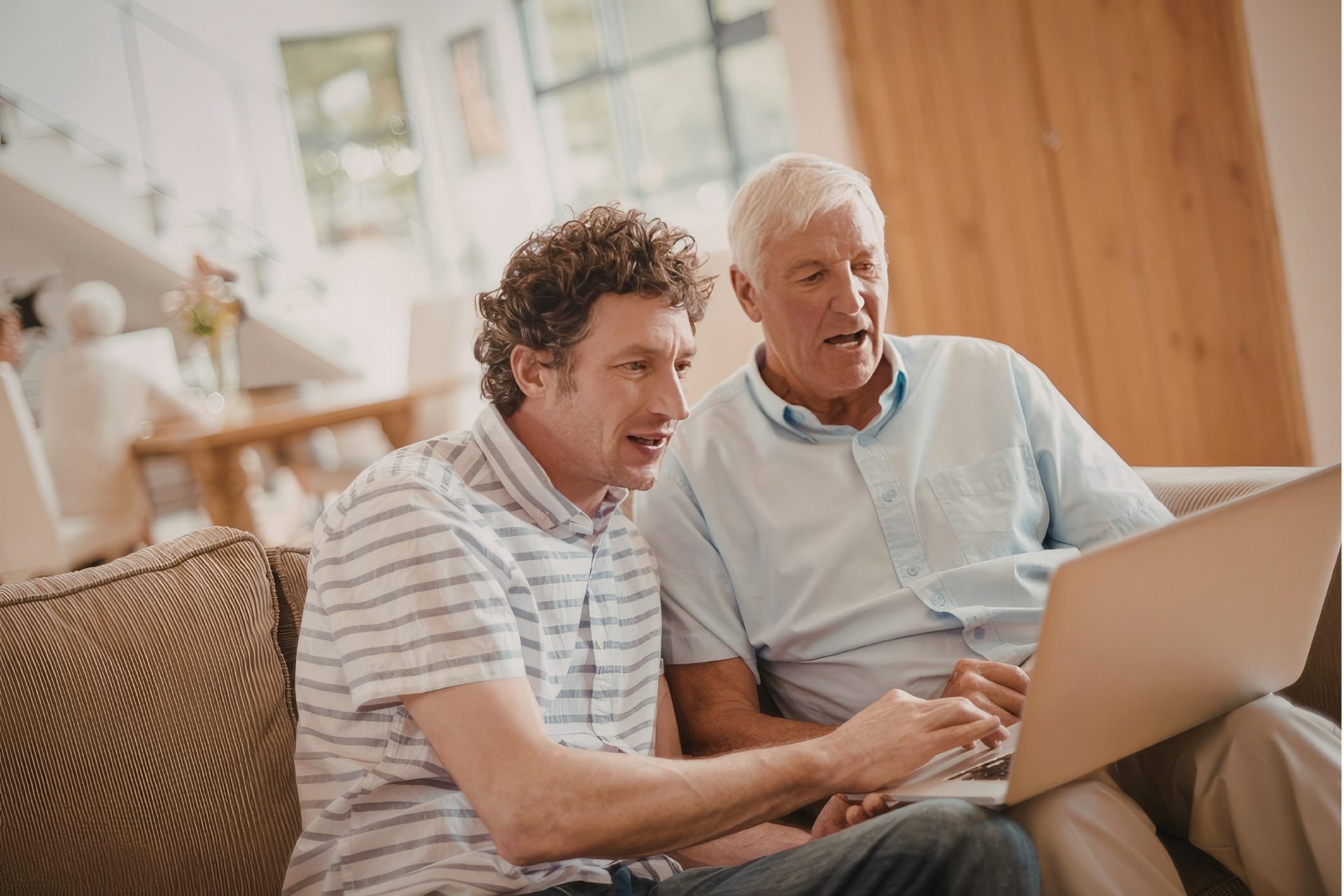 collector working with his son to set up a website for his collection.