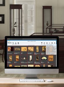 mockup of emuseum on a computer in a museum office