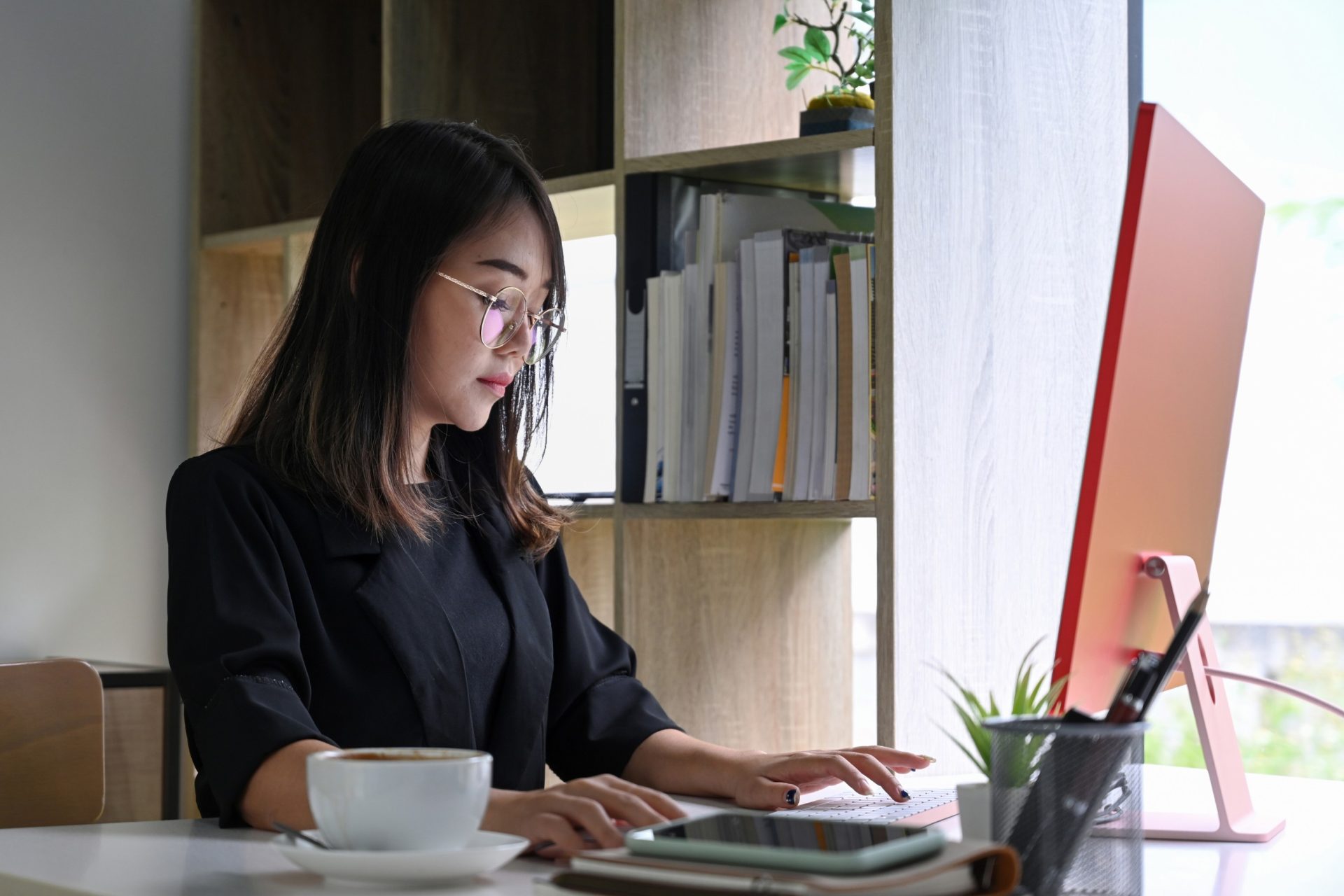gallery staff member working at her desktop