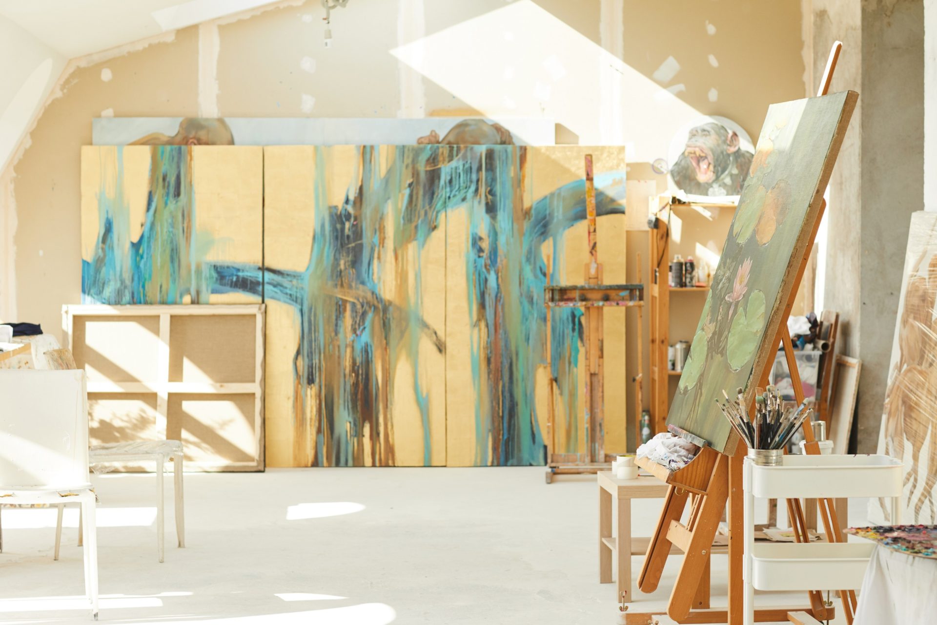 artist studio with large bright paintings