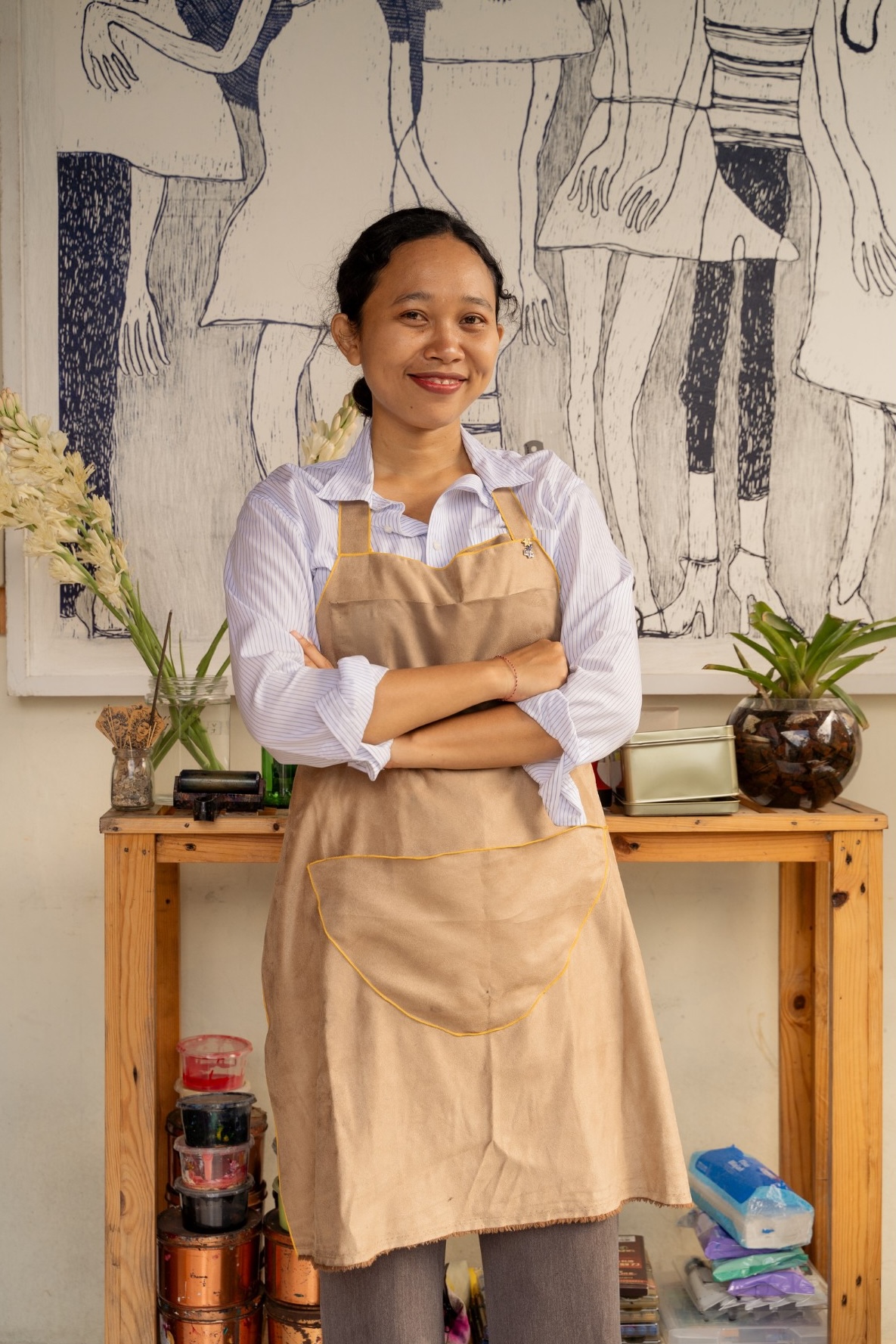 printmaker standing in front of a piece.