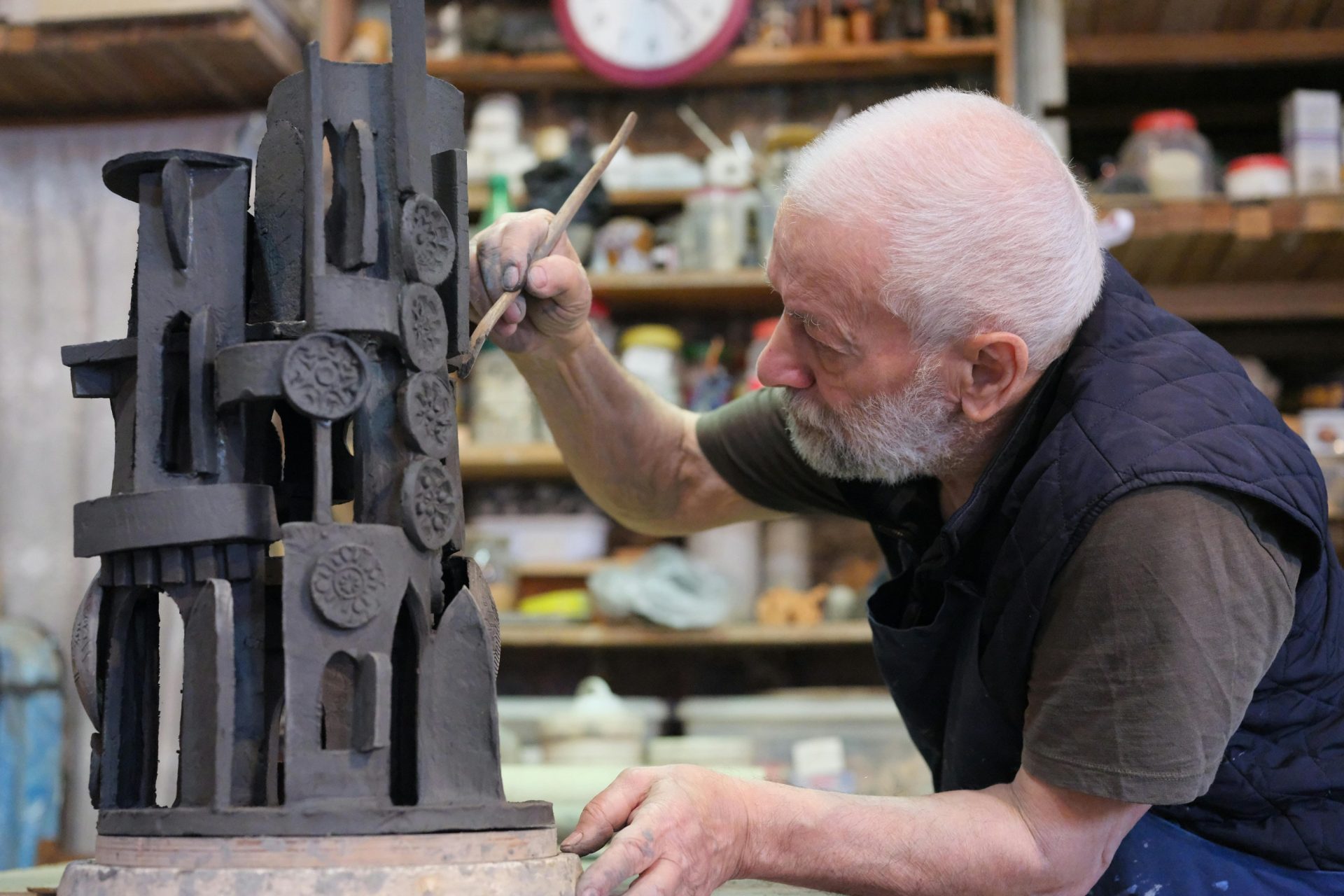 sculptor working on an abstract piece.