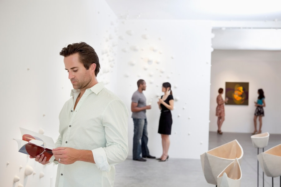 Visitors viewing artwork in an art gallery