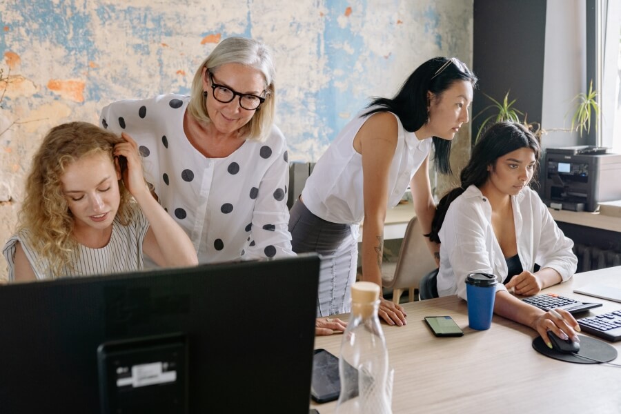 Gallery team collaborating in an office