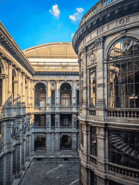 The ornate neoclassical courtyard and glass rotunda of the National Art Museum of Mexico City, the subject of this Gallery Systems case study