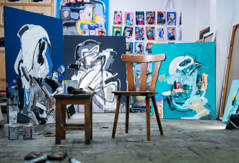 Artist studio with empty chair in the middle