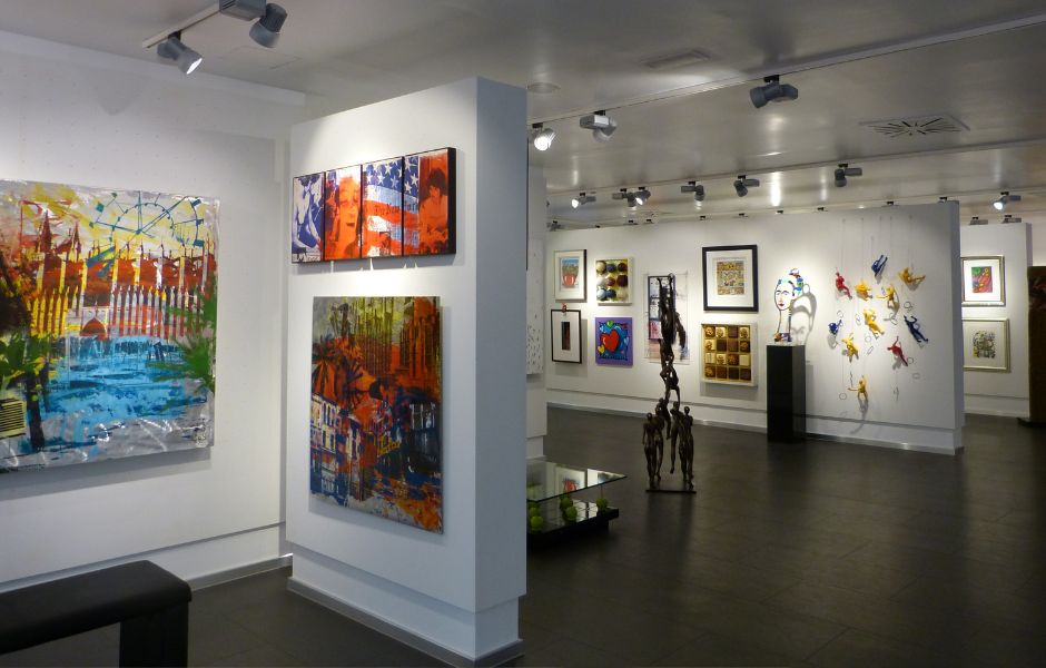 An in-person gallery space filled with diverse artwork, illustrating the physical collections EmbARK helps bring online.