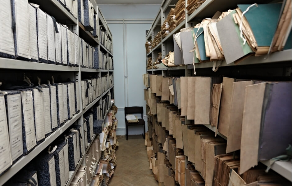 Messy records on shelves.